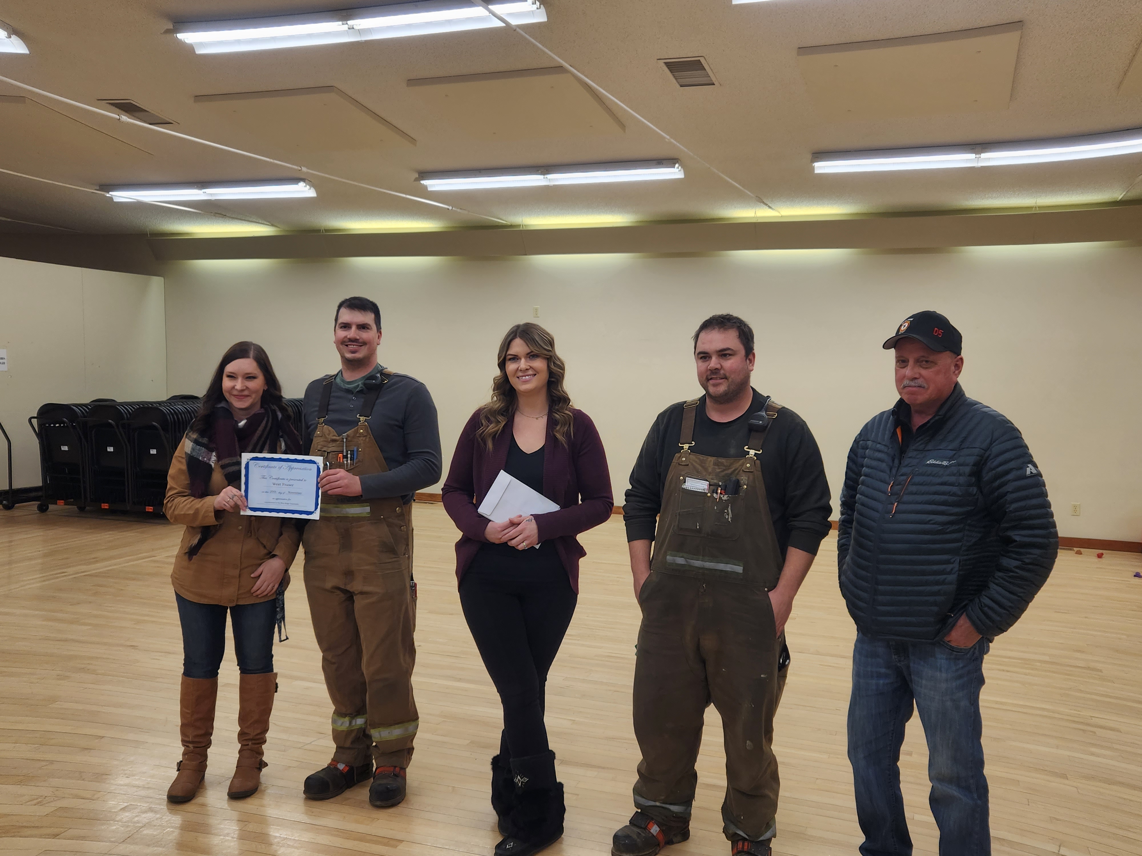 Raymond Shura, Blue Ridge Lumber (left) and Chris Meunier, Ranger Board (right)—who both helped with the renovations—accept thanks on behalf of the volunteer team from the Blue Ridge Community League.