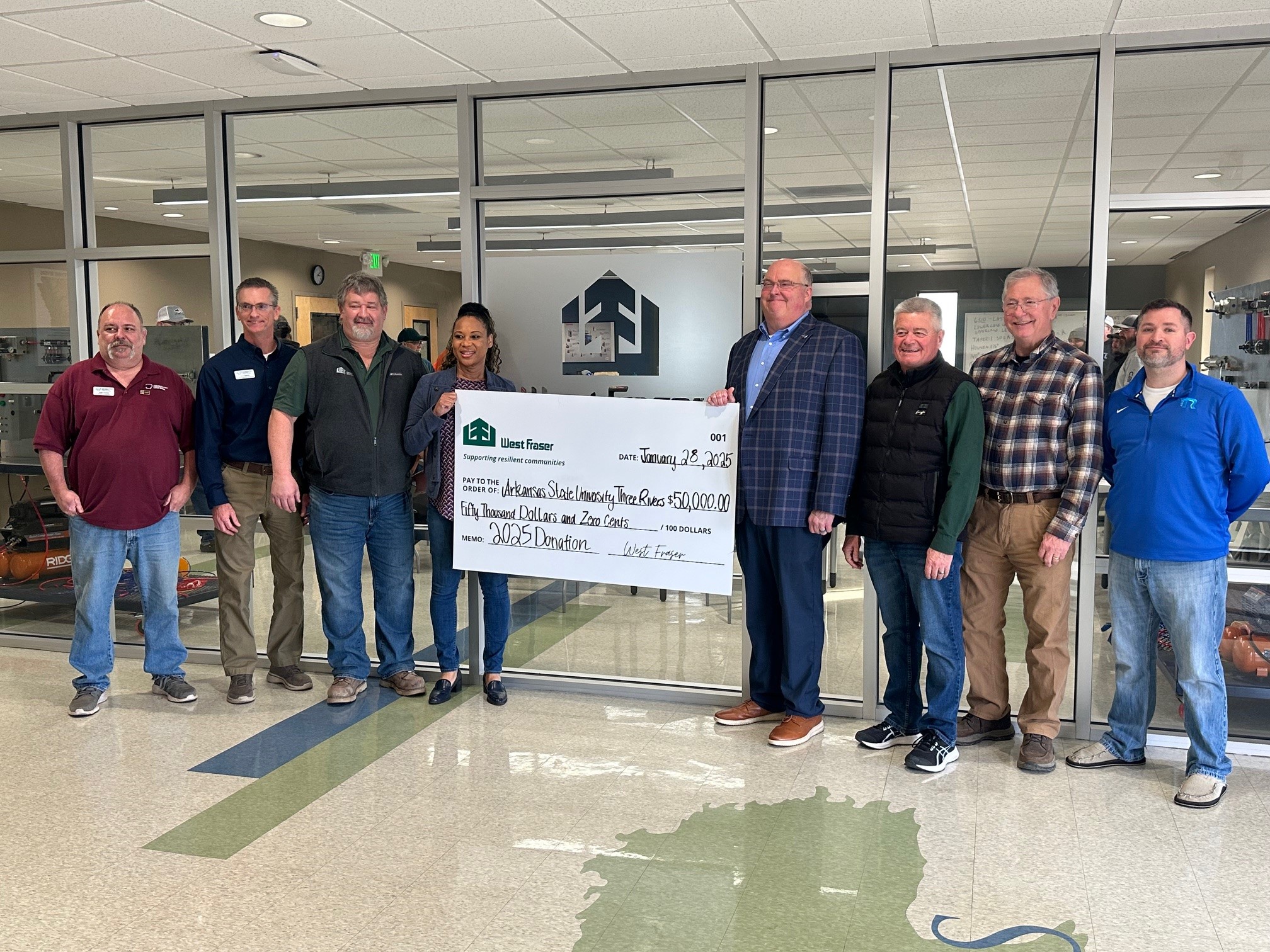 West Fraser presents ASU Three Rivers with a big "cheque" to celebrate the donation and partnership. 