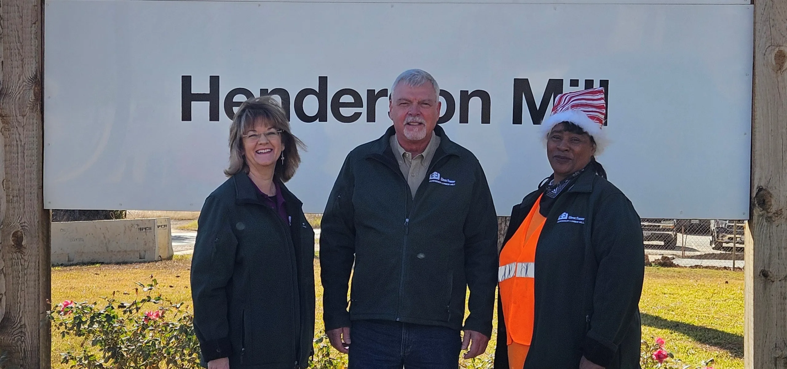 Vickie Gonzalez, Raymond Mitchell and Sonya White stand outside the mill.