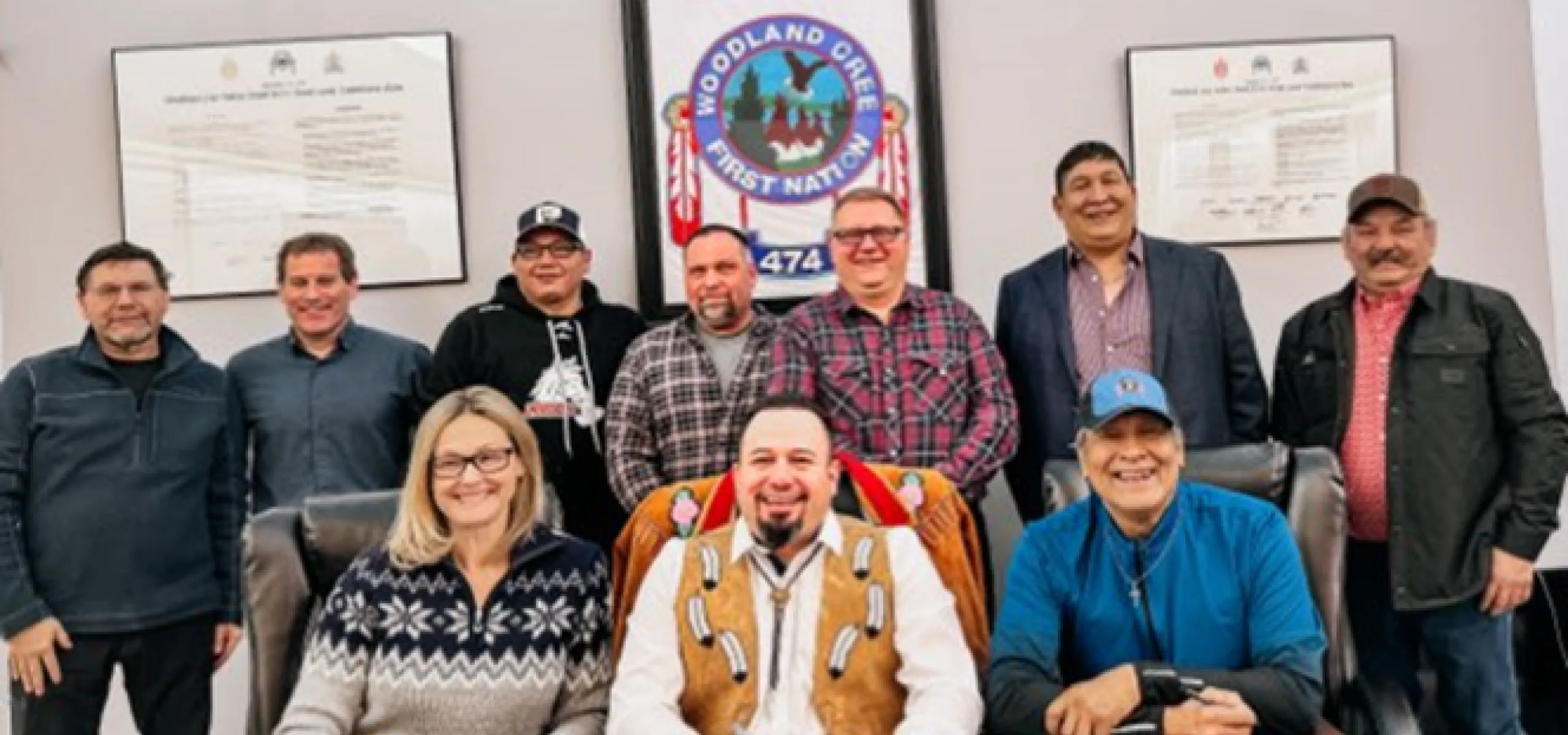 People gathered behind a table