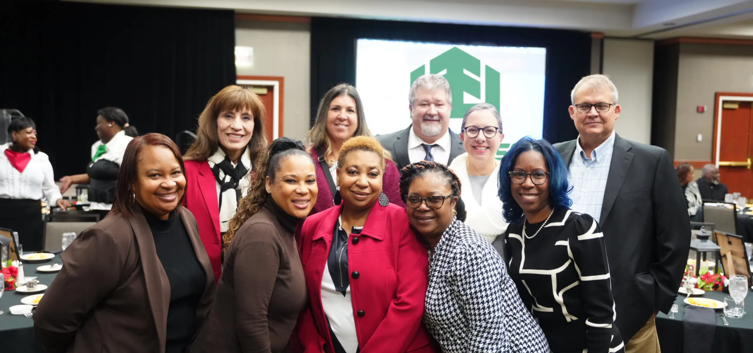 A group of people posing together indoors at the L.C. and Daisy Bates Black History Brunch event.