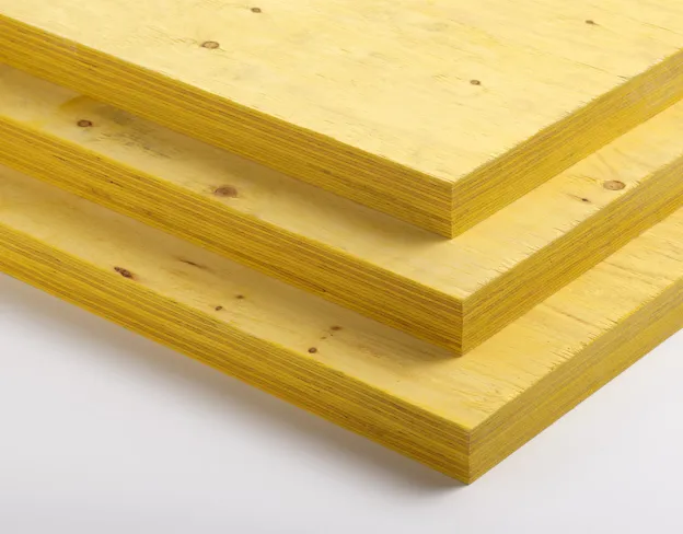 Three stacked sheets of yellow plywood, viewed from the side.