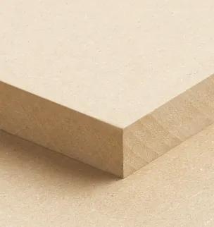 Close-up of a beige MDF board with a smooth surface and sharp edges, positioned diagonally against an identical board beneath it.