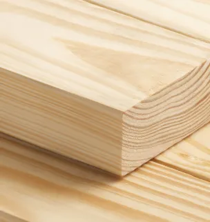 Close-up of stacked wooden planks with visible grain patterns on a light background.