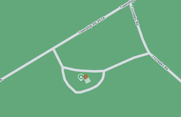 A map showing a marker at the intersection of Township Rd 493A and Tricera Rd, with the marker pinpointing a central spot within a looped road.