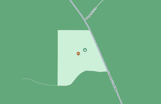 A map showing a campsite located west of Forestry Trunk Road. The campsite is marked with a tent icon, and a separate pin marker is also present nearby within a designated area.