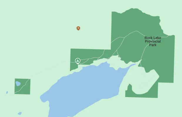 Map showing Rock Lake Provincial Park with marked locations for camping and points of interest. The park area is highlighted in dark green, with roads and lake areas clearly visible.