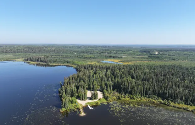 The large day-use area is clearly visible in the foreground. The campground is located behind the day-use area close to the lake.