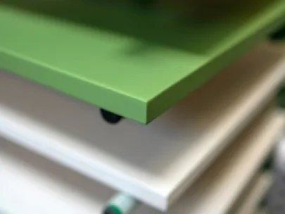 Green and white stacked shelving with visible round connectors.