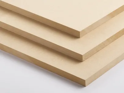 Three stacked sheets of medium-density fiberboard (MDF) on a flat surface.