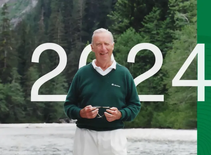 Elderly man smiling outdoors with trees in background. Large text: "2024." Green design element on the right side.